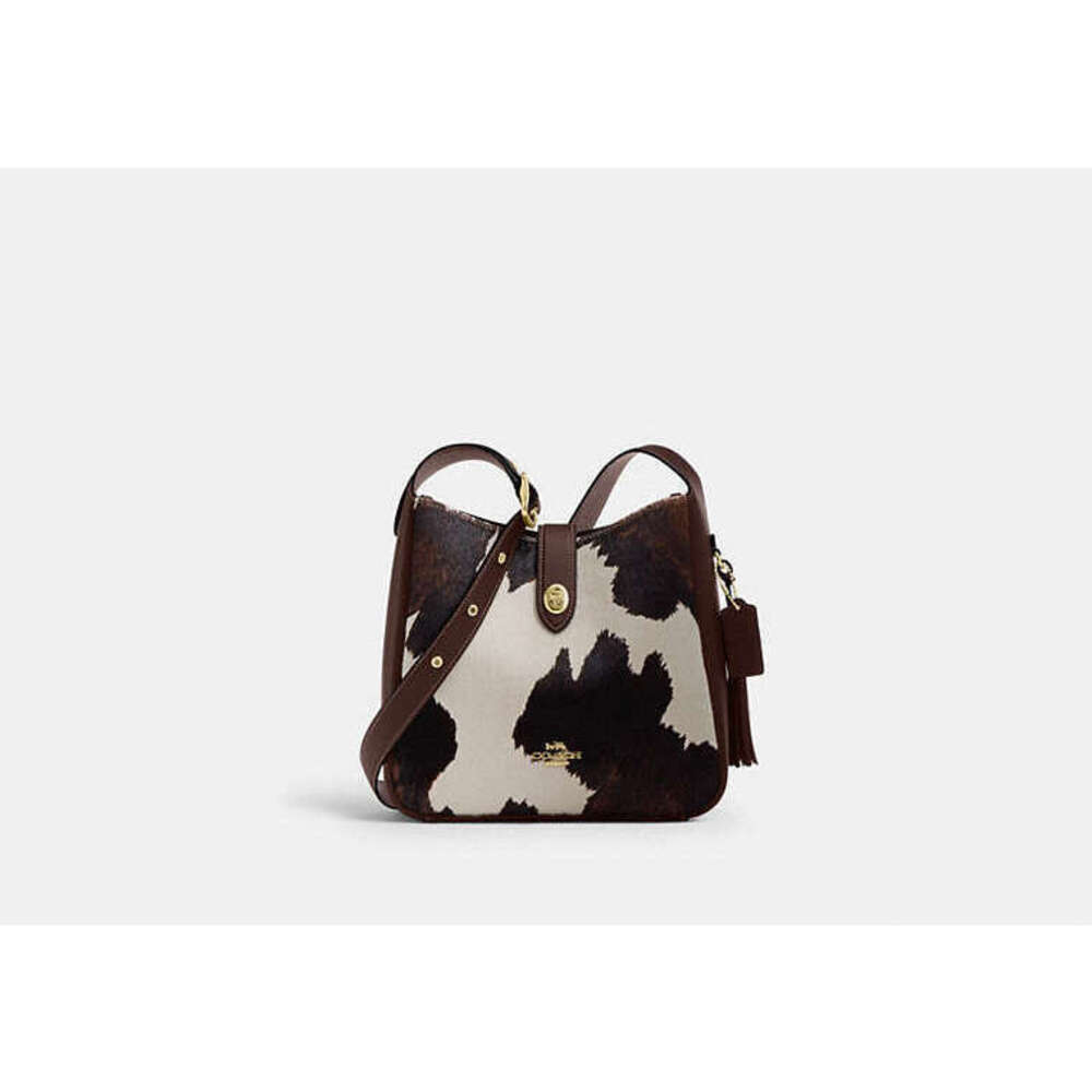 Hadley Convertible Crossbody Bag With Cow Print And Tassel